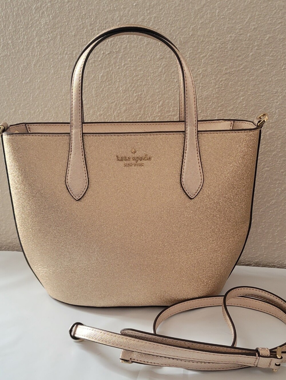 Brand New Kate Spade Glimmer Small Satchel in bright rose gold.
